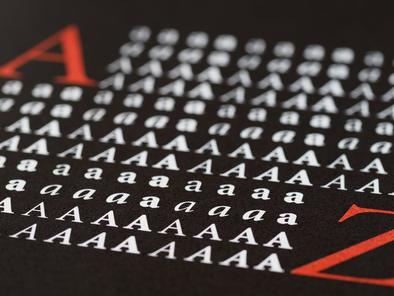 project-02-b Close-up image showcasing various styles of the letter A in print, emphasizing typography diversity.